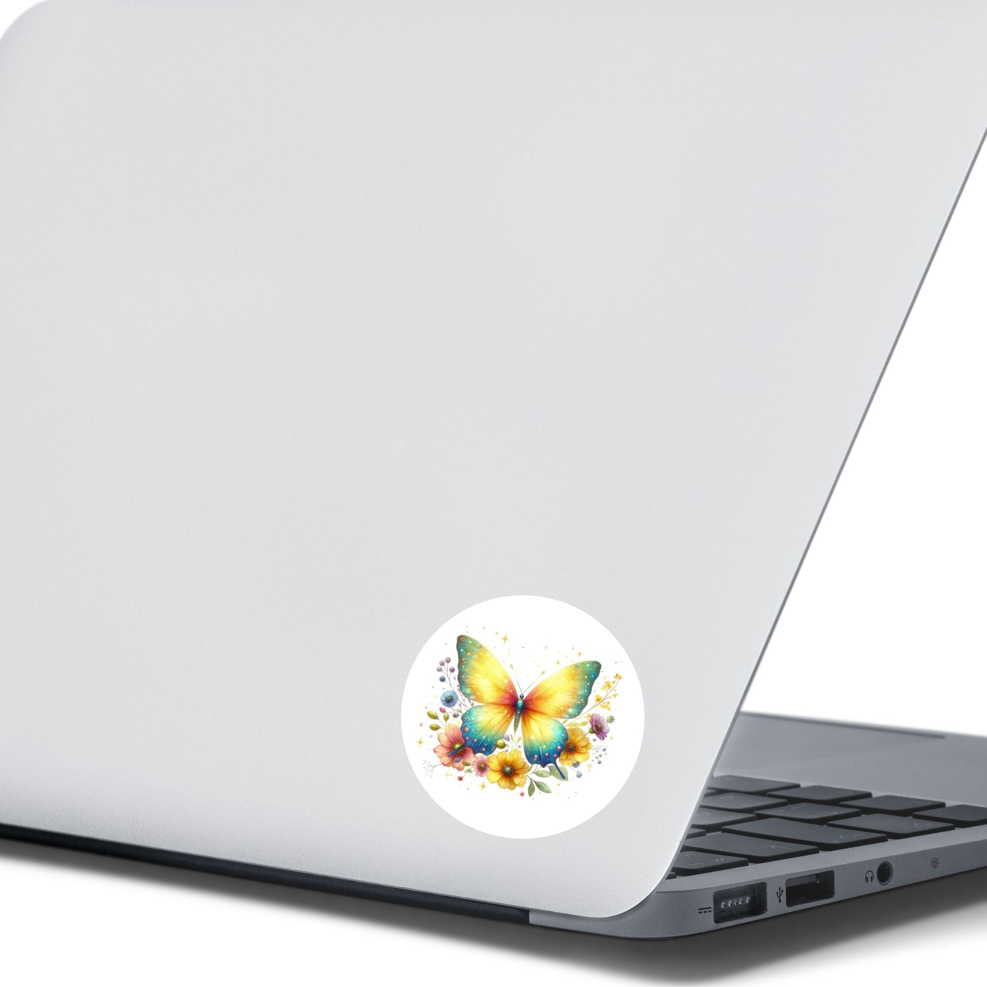 This image shows the Yellow Butterfly Die-Cut Sticker on the back of an open laptop.