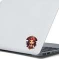 Load image into Gallery viewer, This image shows the Pirate Girl Die-Cut Sticker on the back of an open laptop.
