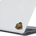 Load image into Gallery viewer, This image shows the Pirate Treasure 2 Die-Cut Sticker on the back of an open laptop.
