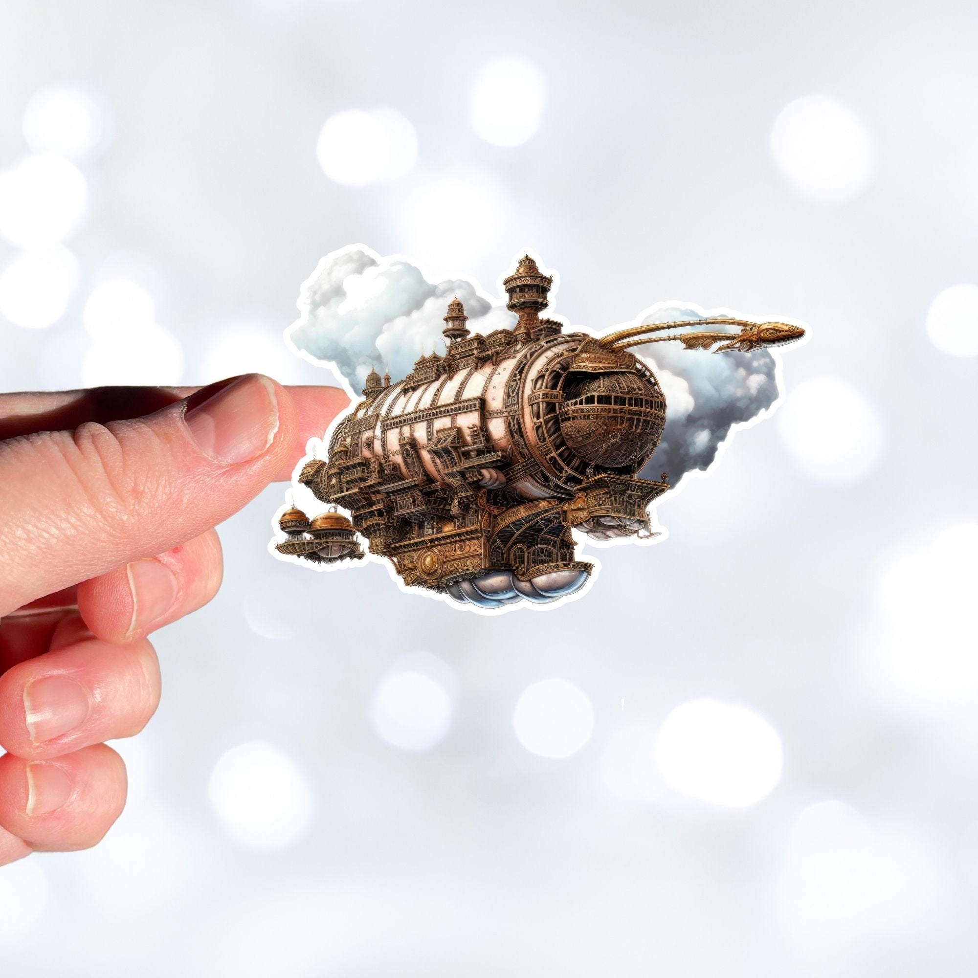 This image shows a hand holding the Steampunk Airship 1 Die-Cut Sticker