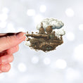 Load image into Gallery viewer, This image shows a hand holding the Steampunk Airship 3 Die-Cut Sticker.
