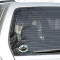 Load image into Gallery viewer, This image shows the Steampunk Airship 4 Die-Cut Sticker on the back window of a car.
