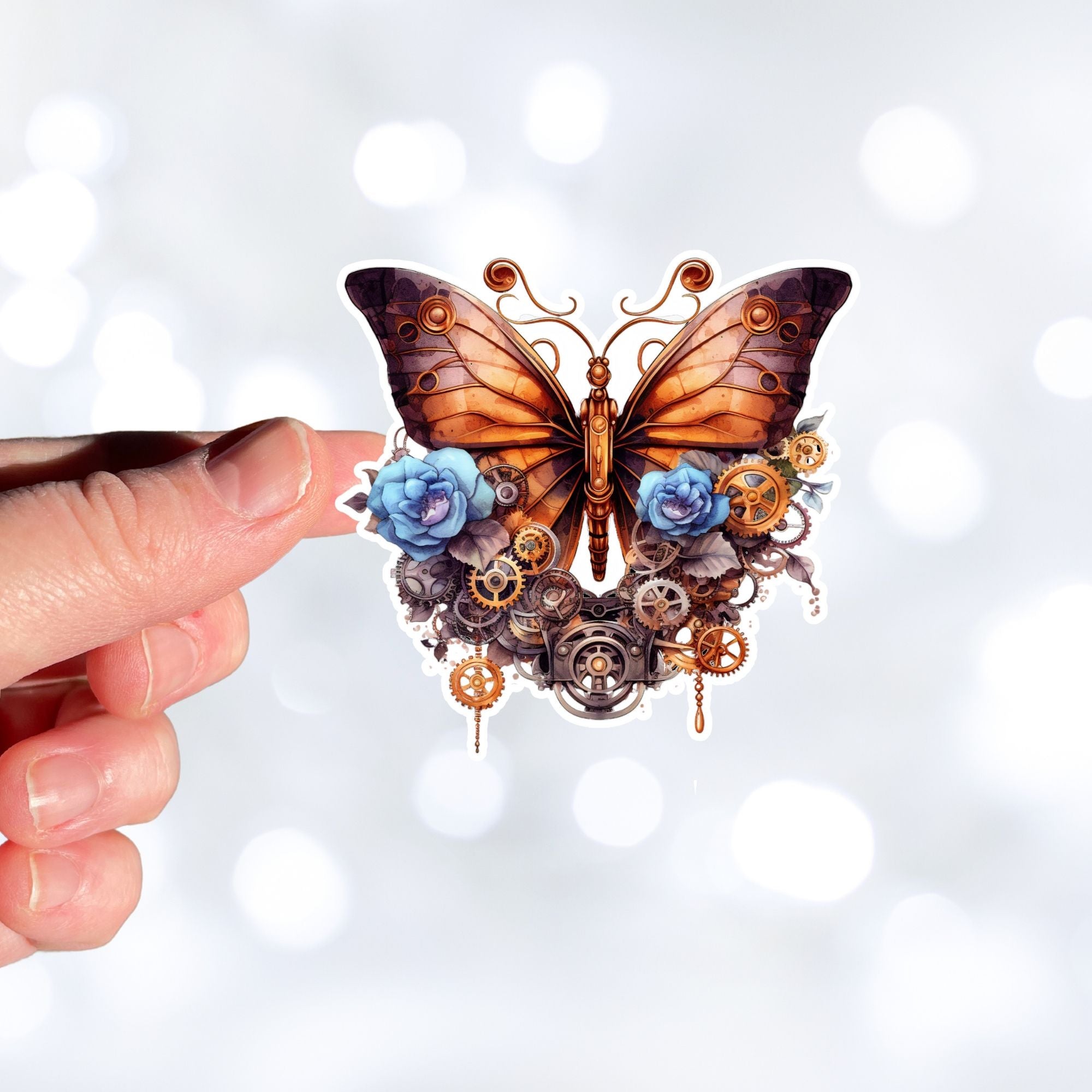 This image shows a hand holding the Steampunk Butterfly 2 Die-Cut Sticker.