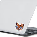 Load image into Gallery viewer, This image shows the Steampunk Butterfly 2 Die-Cut Sticker on the back of an open laptop.
