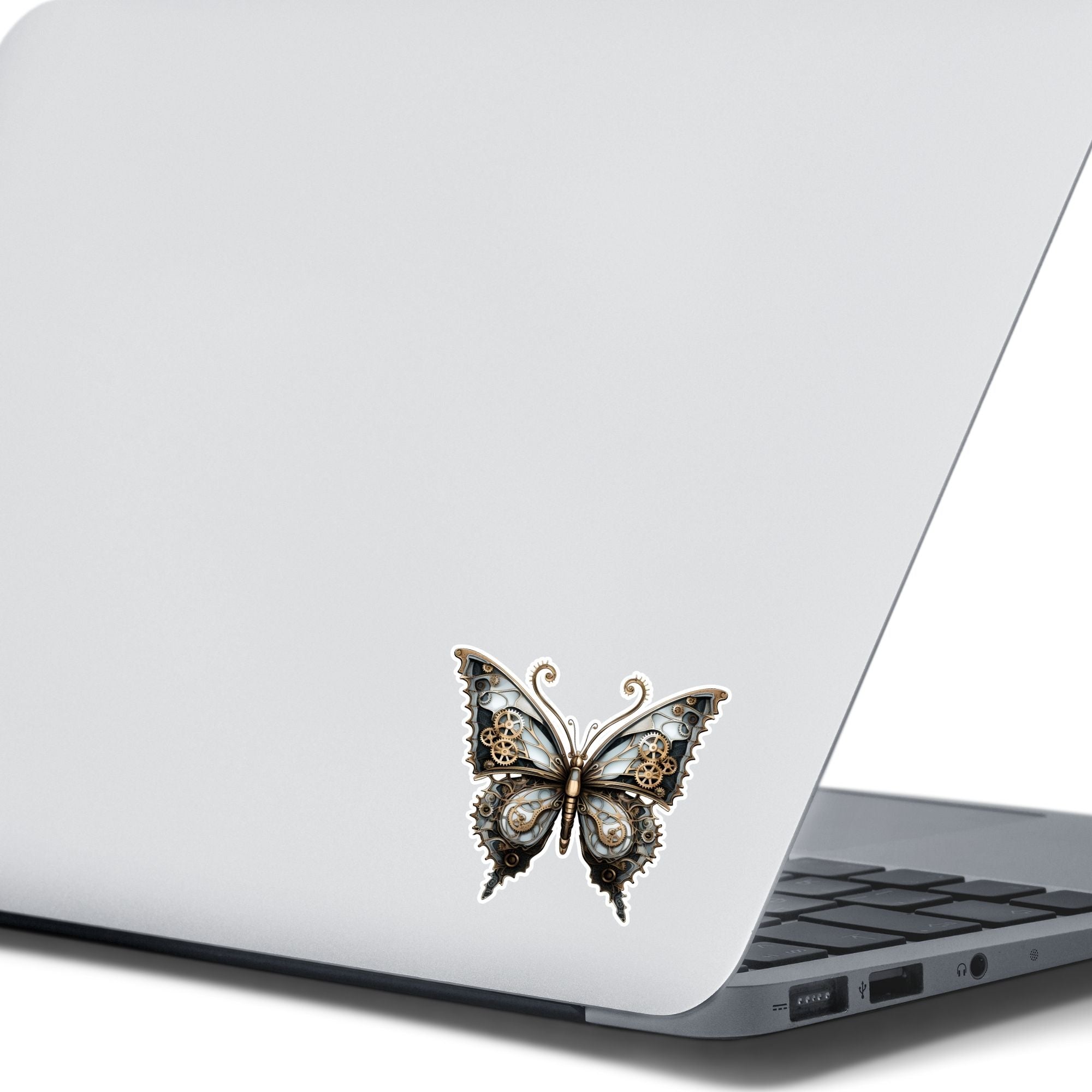 This image shows the Steampunk Butterfly 3 Die-Cut Sticker on the back of an open laptop.