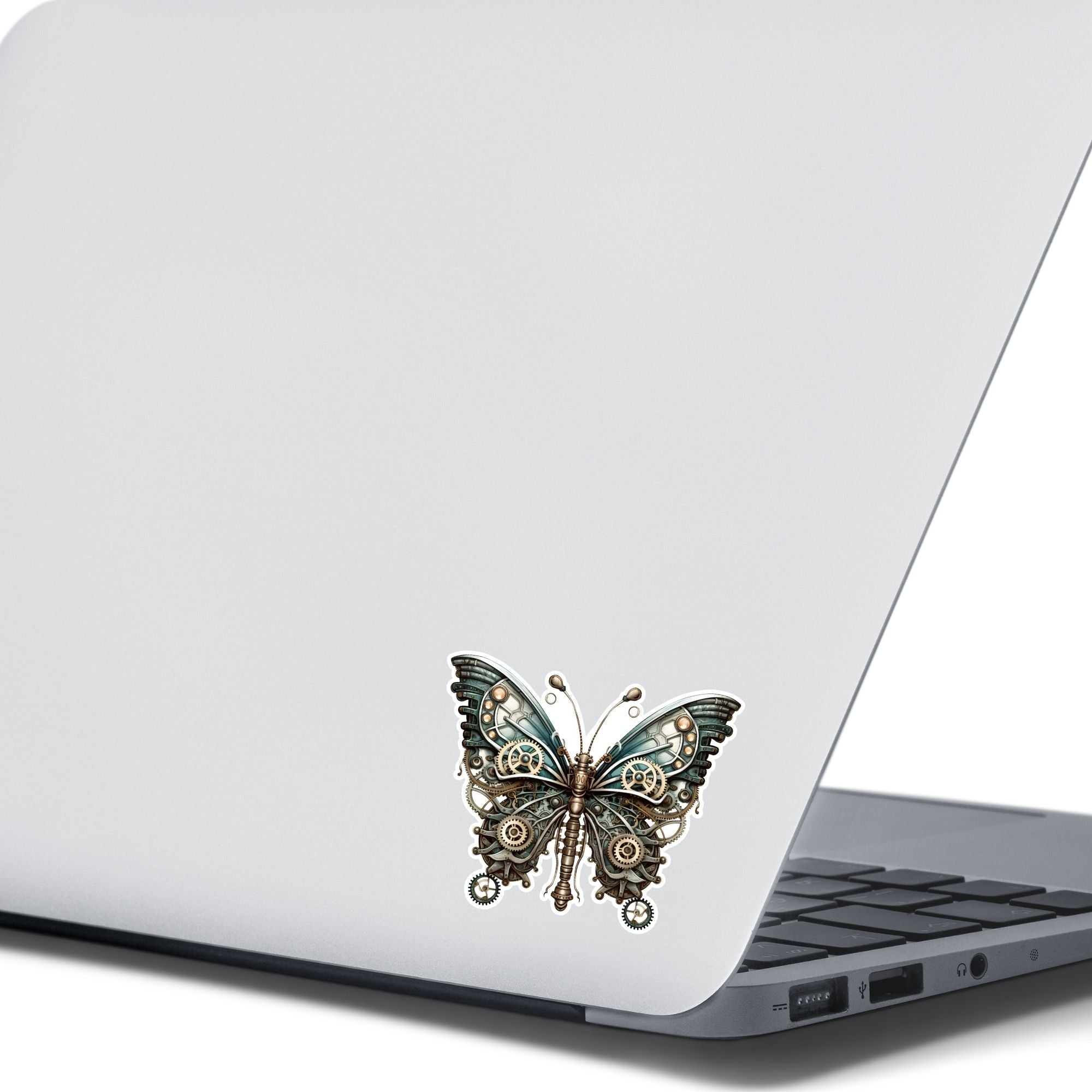 This image shows the Steampunk Butterfly 4 Die-Cut Sticker on the back of an open laptop.