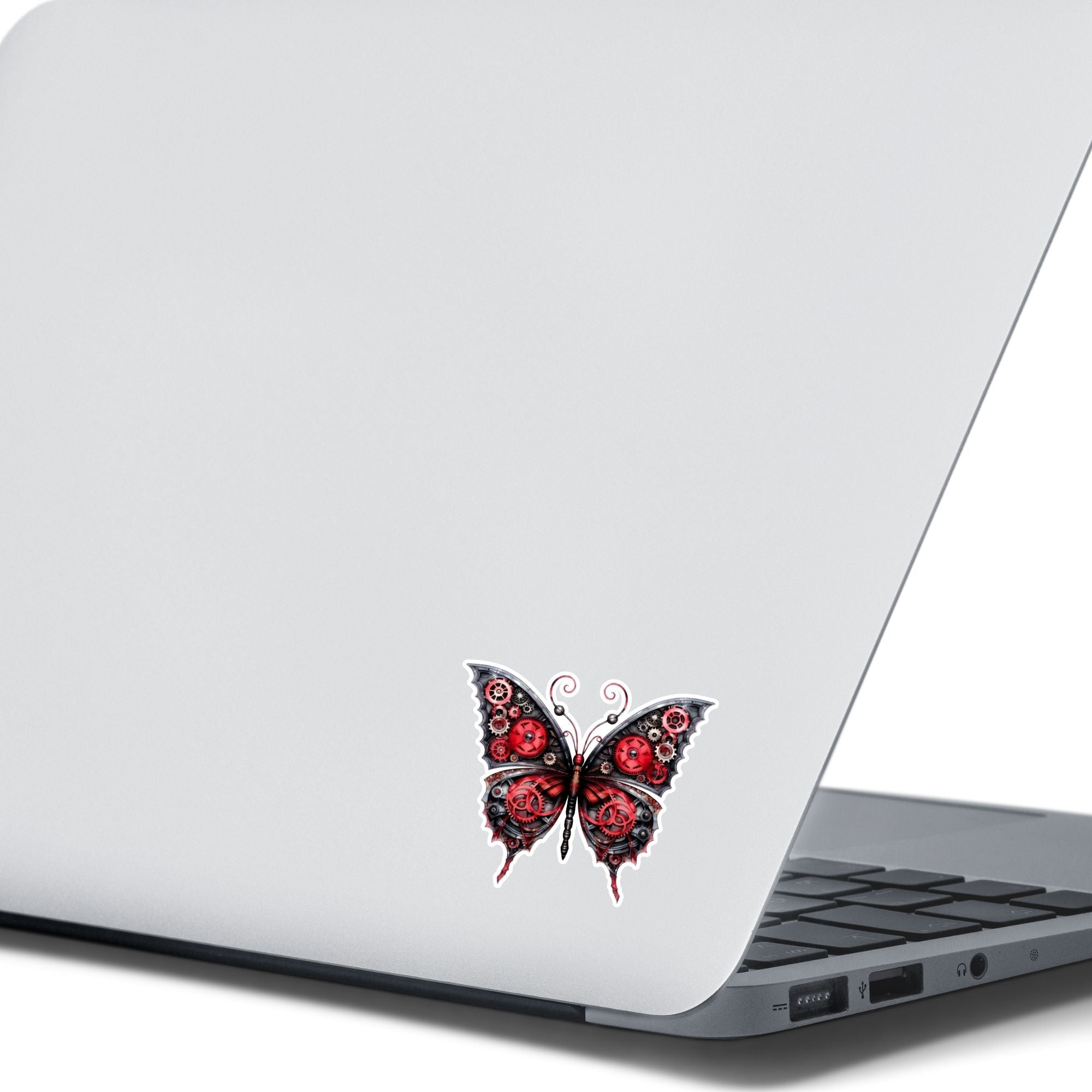 This image shows the Steampunk Butterfly 5 Die-Cut Sticker on the back of an open laptop.