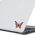 Load image into Gallery viewer, This image shows the Steampunk Butterfly 6 Die-Cut Sticker on the back of an open laptop.
