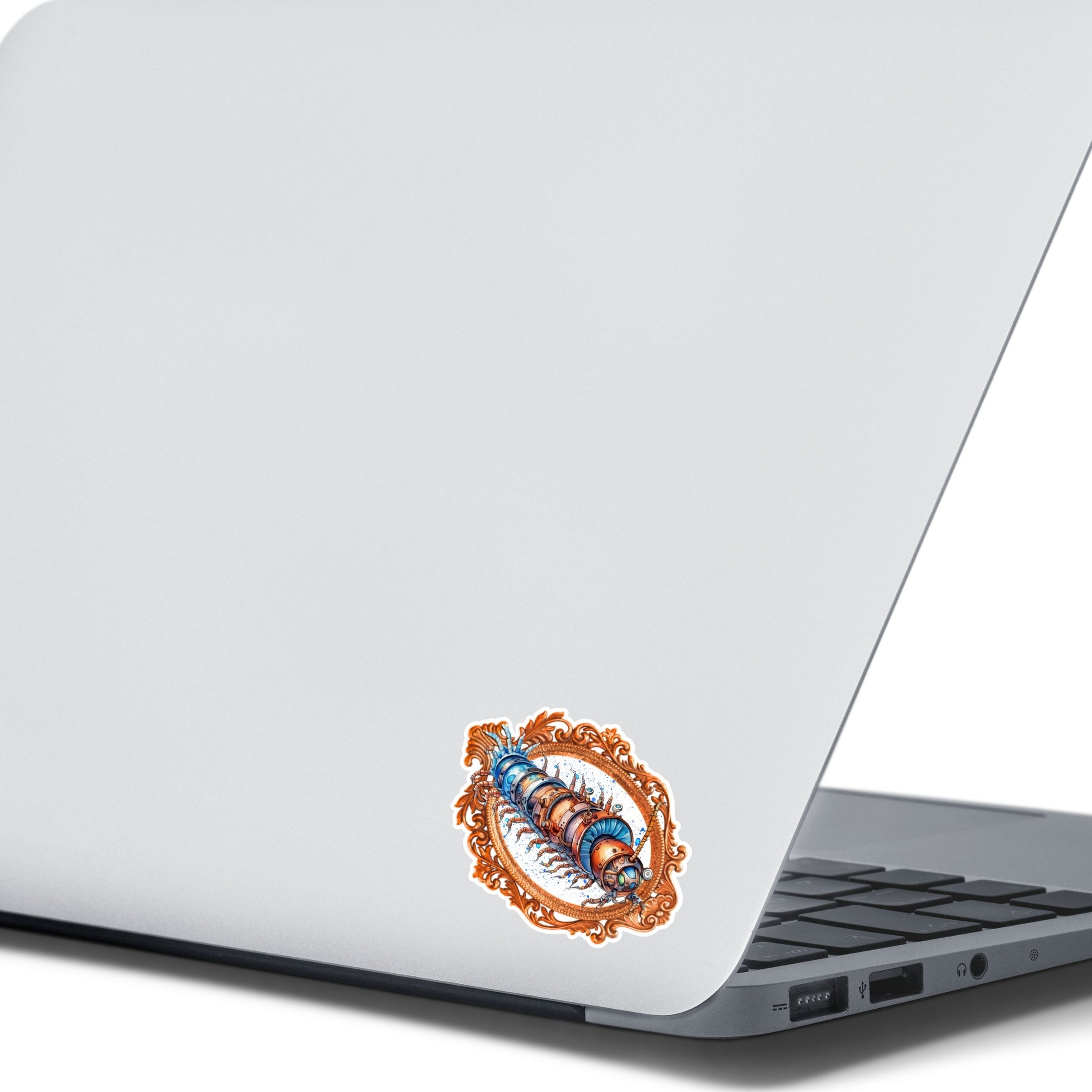 This image shows the steampunk centipede sticker on the back of an open laptop.