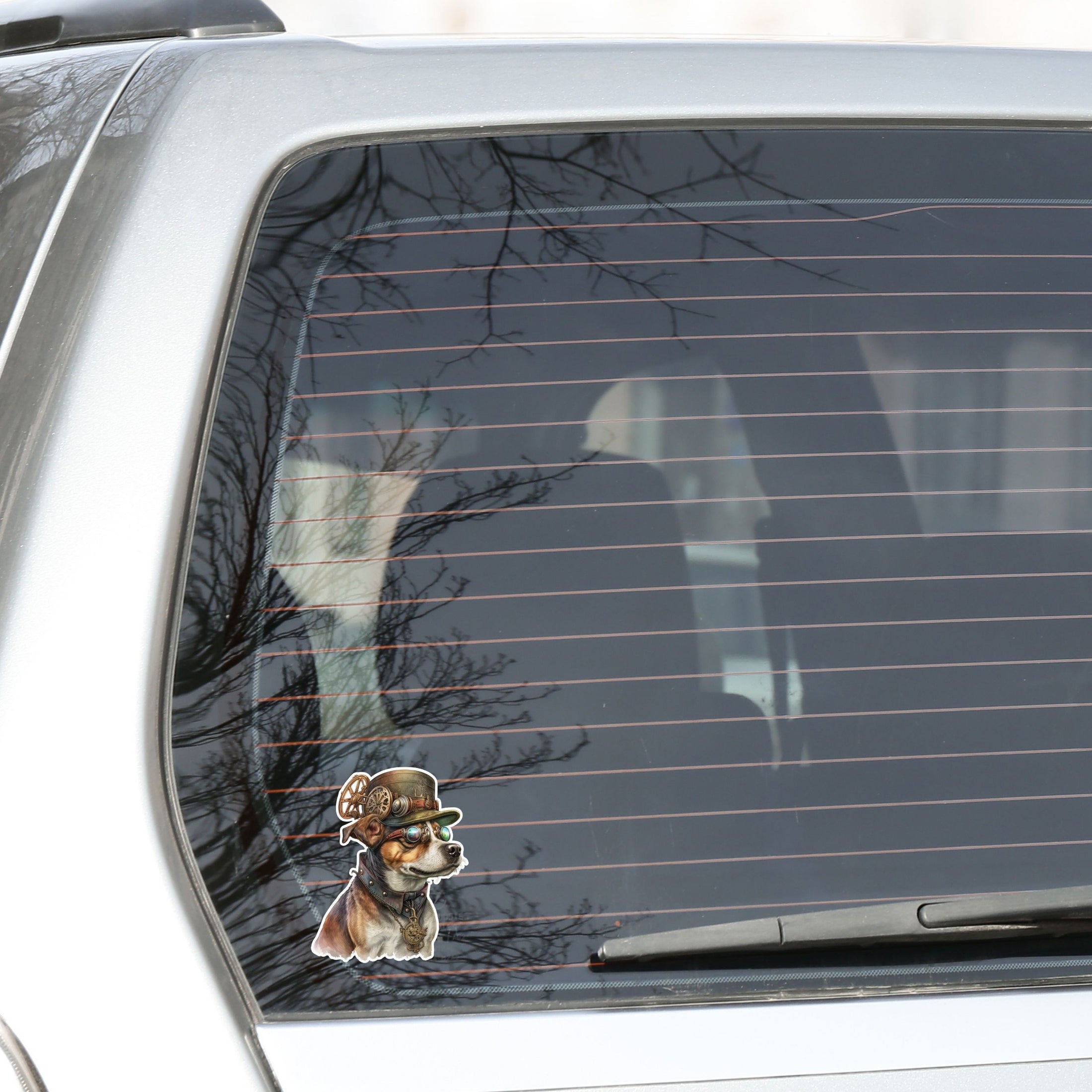 This image shows the steampunk dog sticker on the back window of a car.