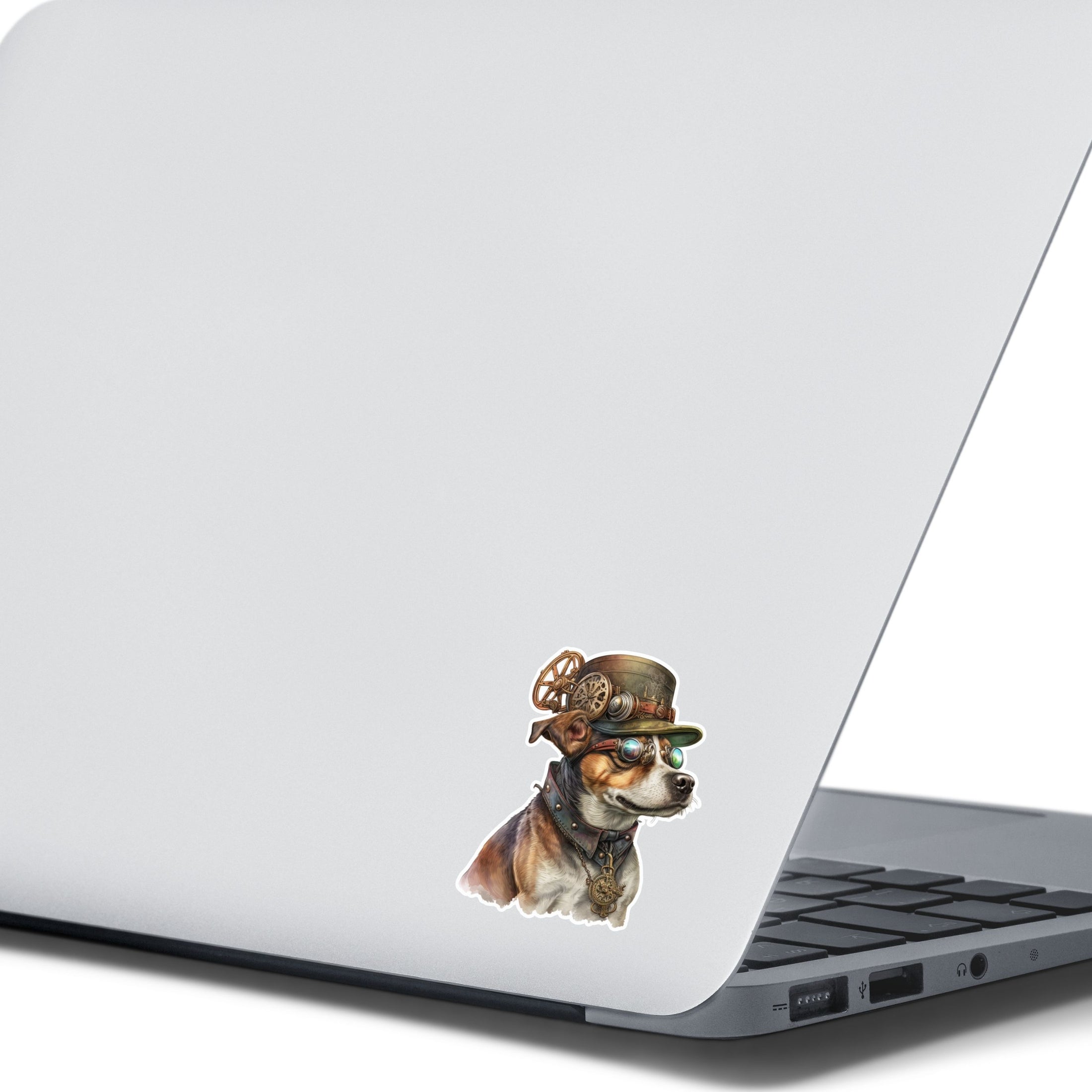 This image shows the steampunk dog sticker on the back of an open laptop.