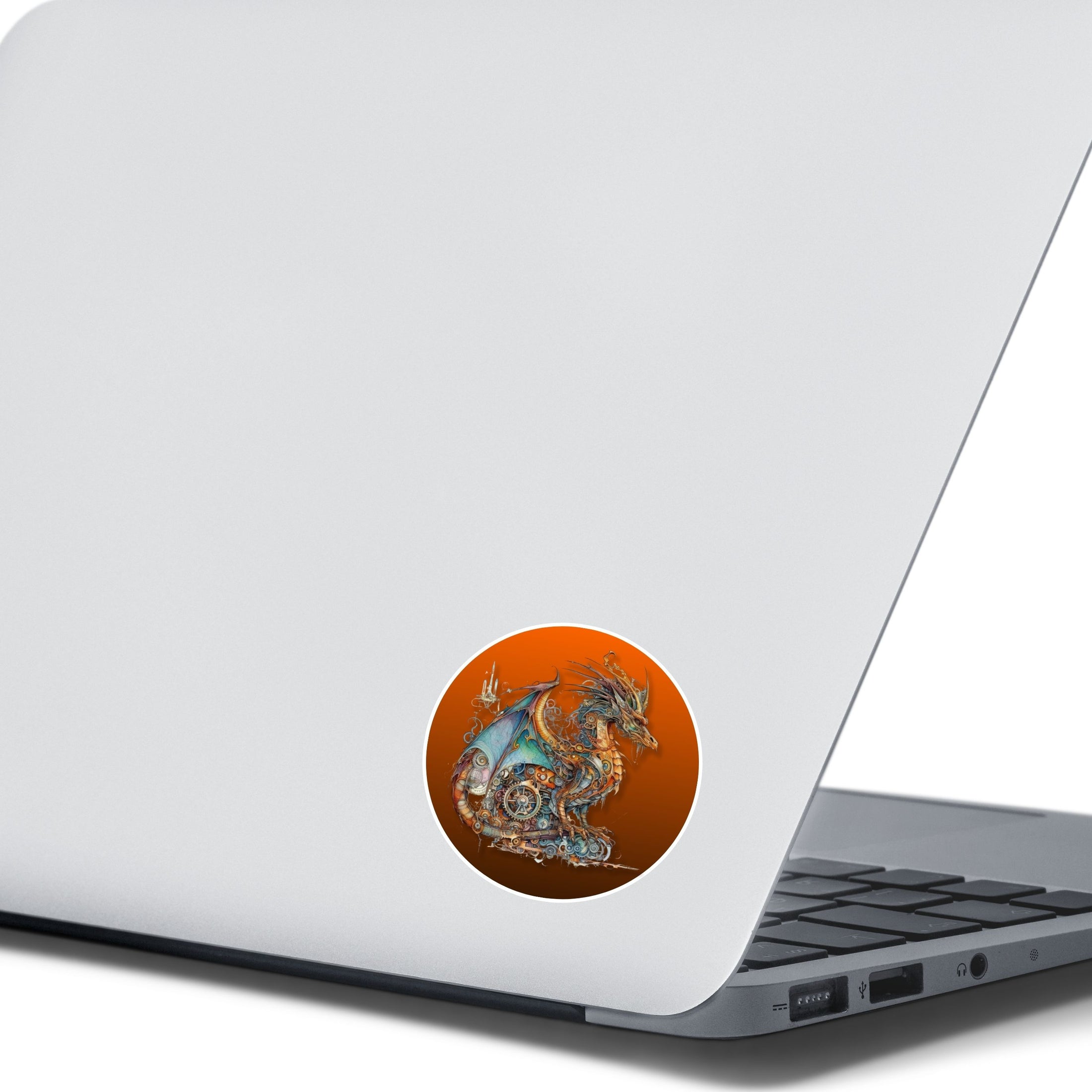 This image shows the steampunk dragon with copper background on the back of an open laptop.