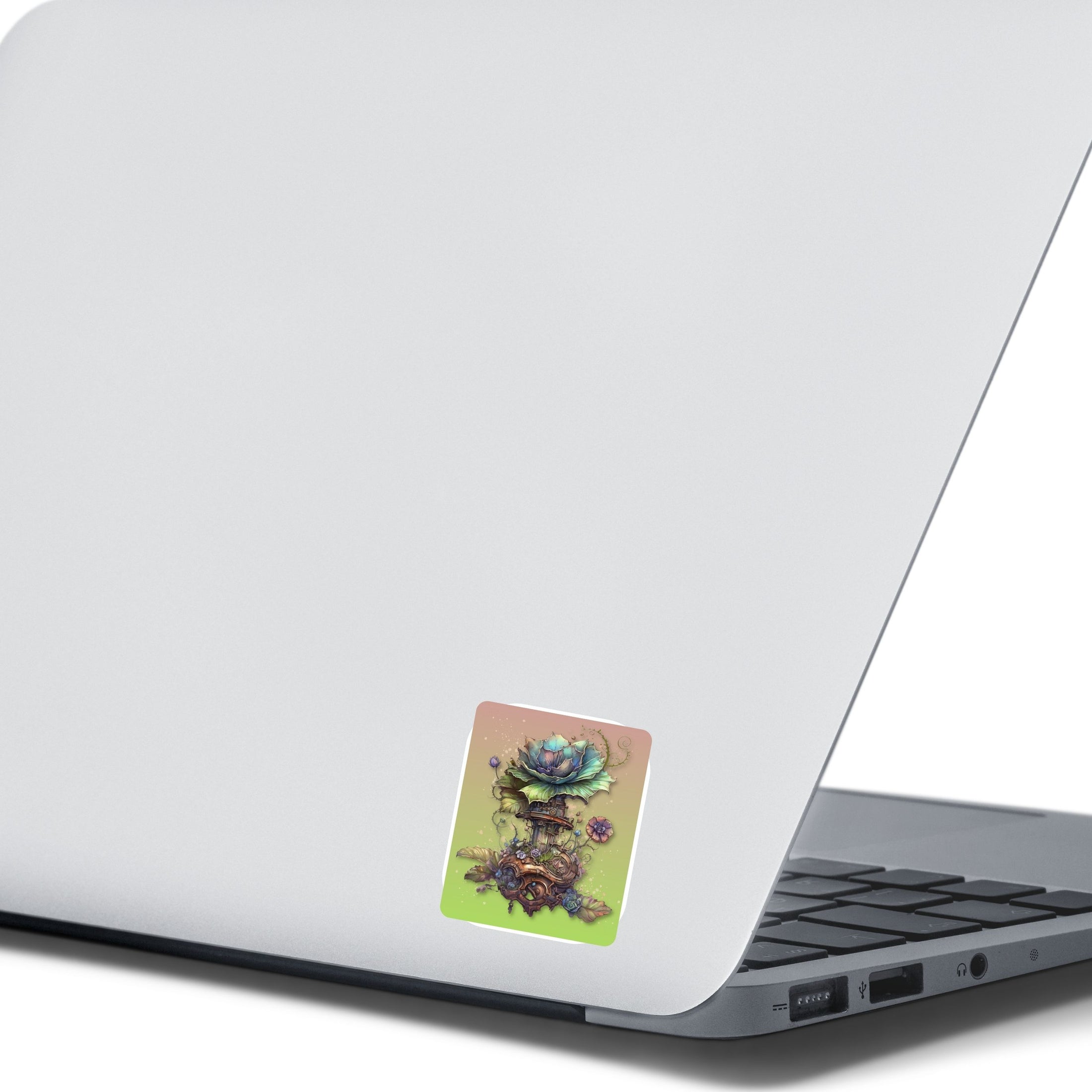 This image shows the steampunk fantasy flower sticker on the back of an open laptop.