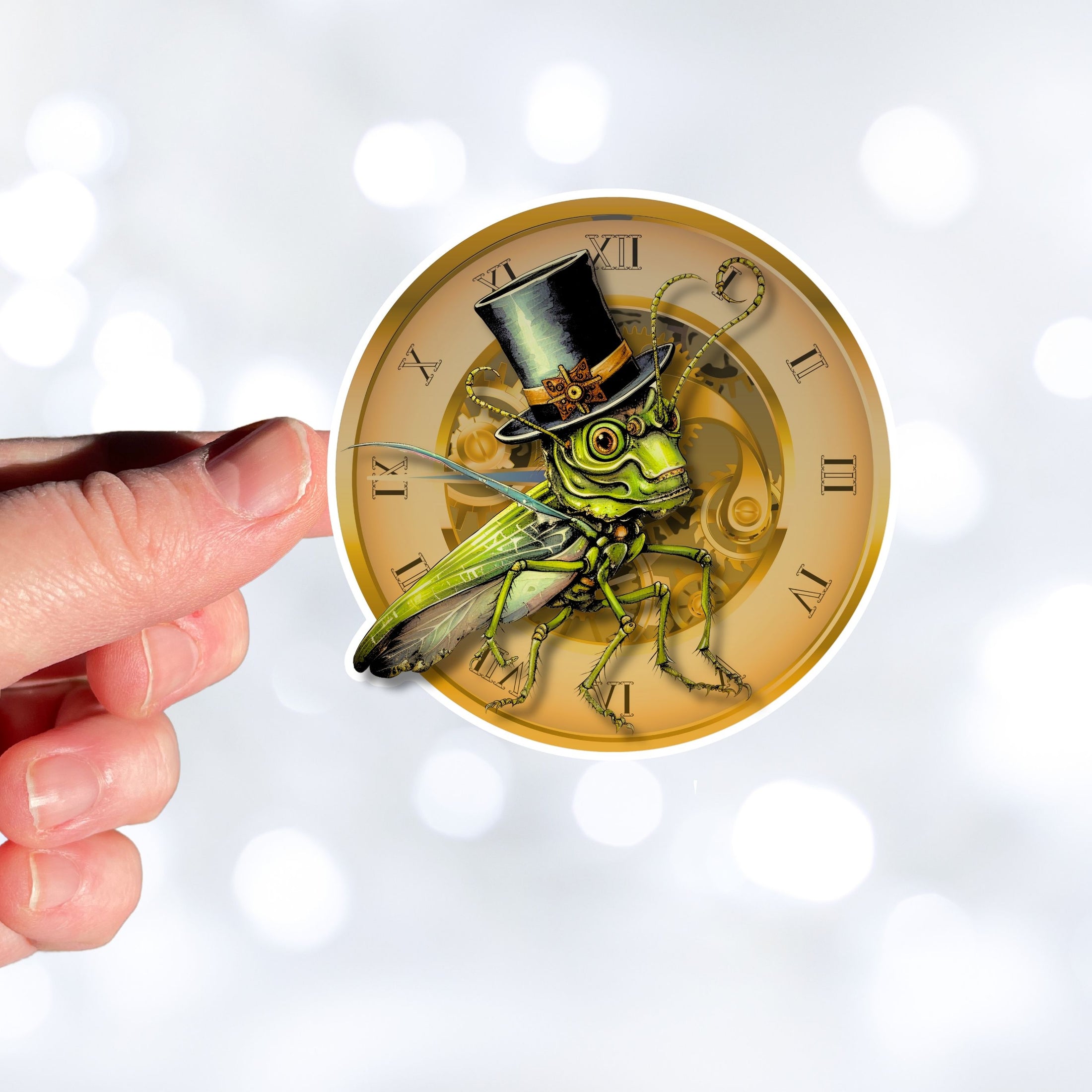 This image shows a hand holding the steampunk grasshopper sticker.