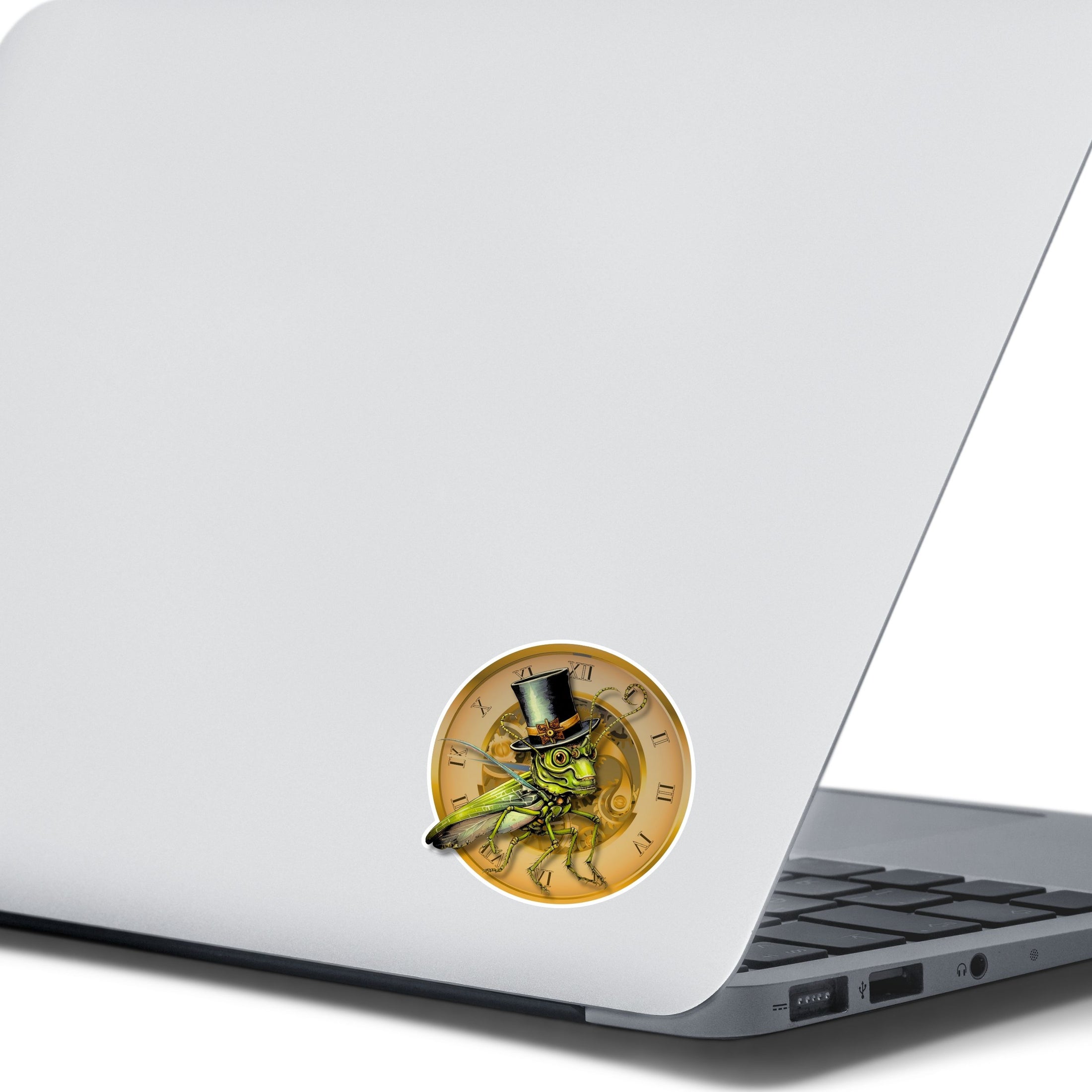 This image shows the steampunk grasshopper sticker on the back of an open laptop.