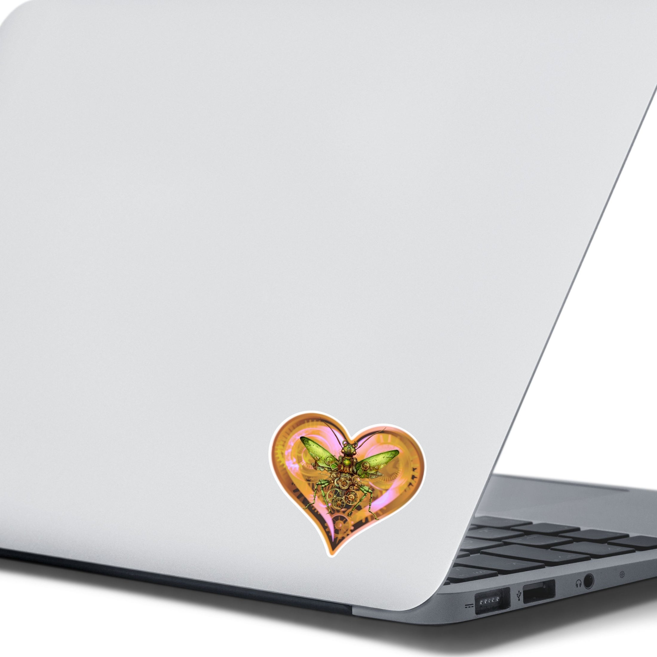 This image shows the steampunk love bug sticker on the back of an open laptop.