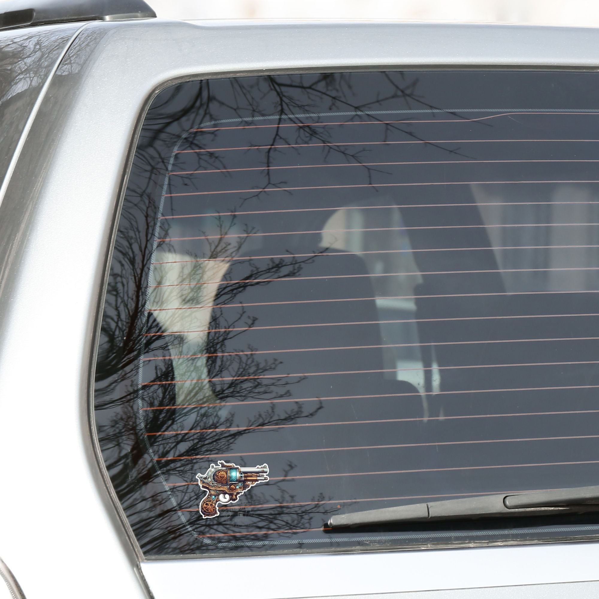 This image shows the Pirate Steampunk Pistol 2 Die-Cut Sticker on the back window of a car.