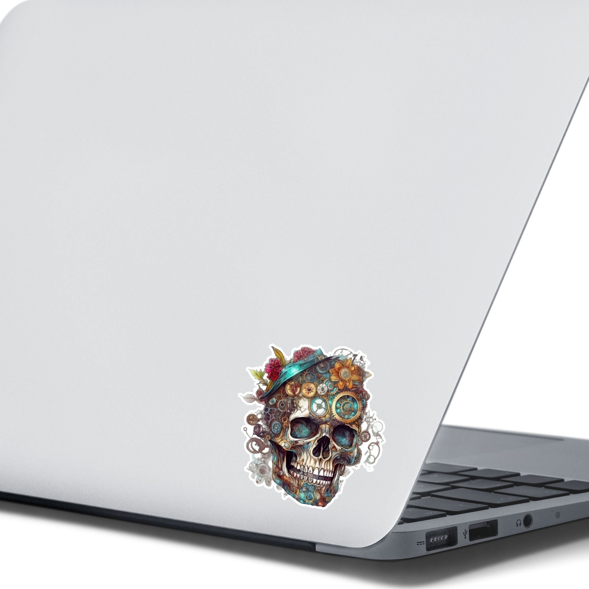 This image shows the Steampunk Skull 2 Die-Cut Sticker on the back of an open laptop.