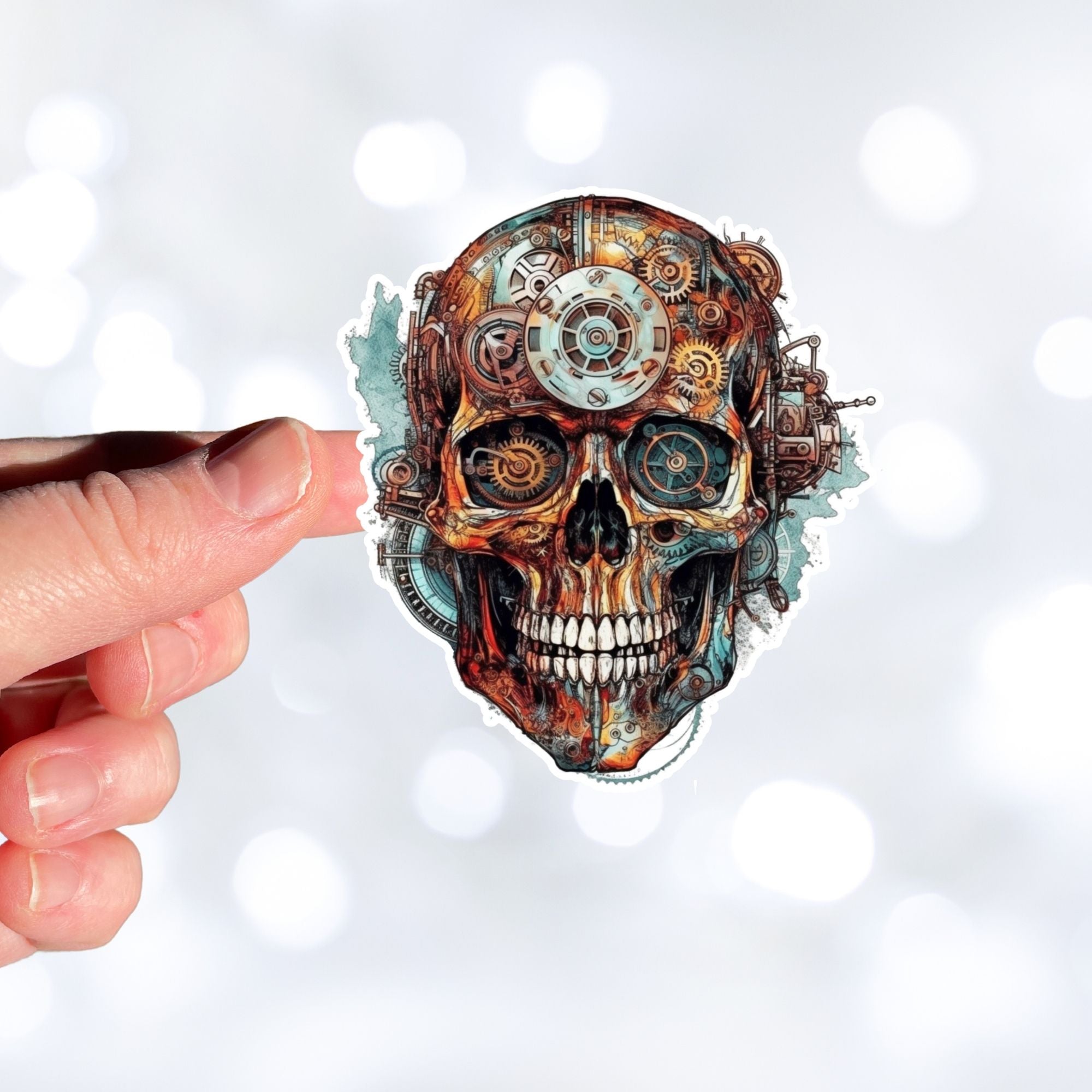 This image shows a hand holding the Steampunk Skull 6 Die-Cut Sticker.