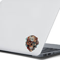 Load image into Gallery viewer, This image shows the Steampunk Skull 6 Die-Cut Sticker on the back of an open laptop.
