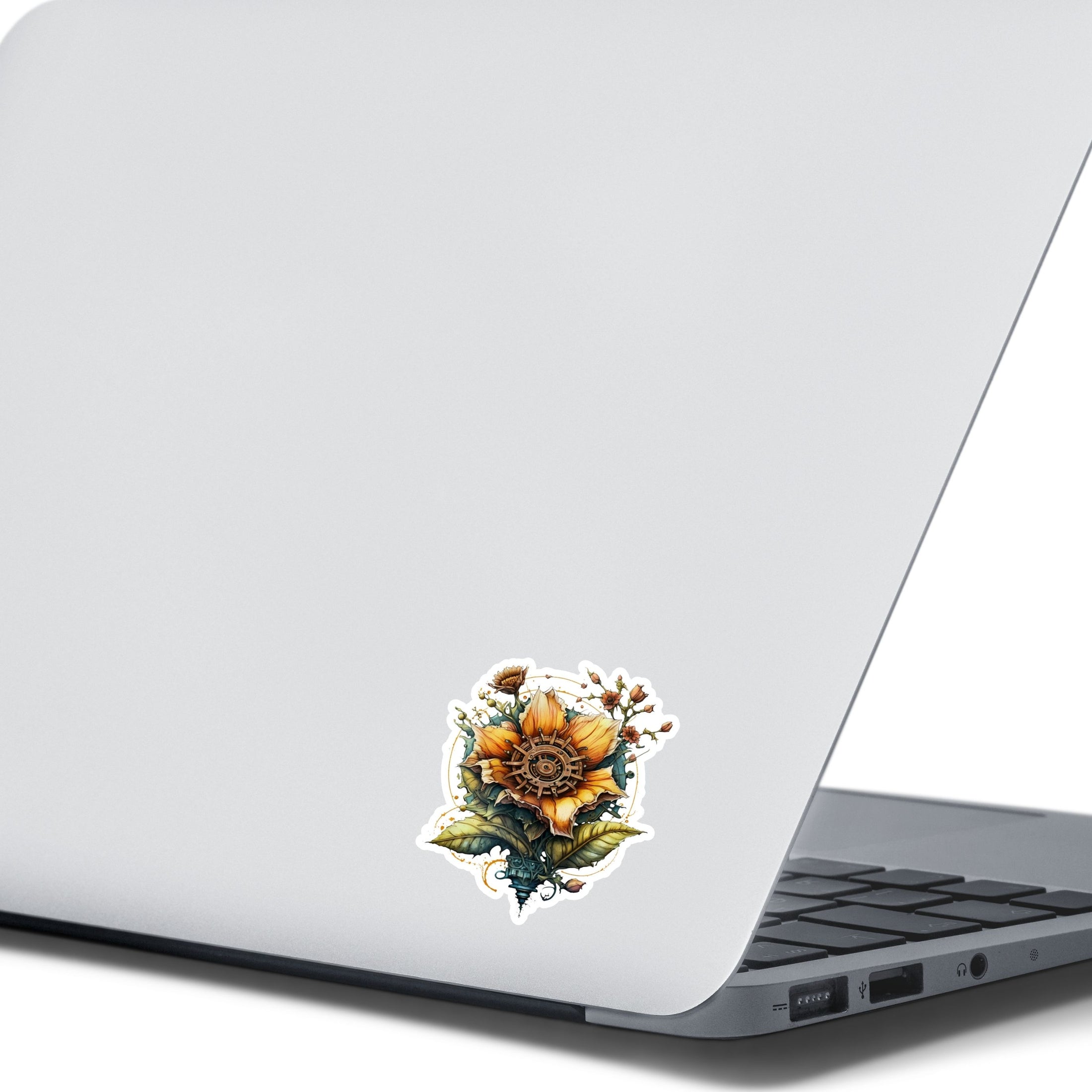 This image shows the steampunk sunflower sticker on the back of an open laptop.