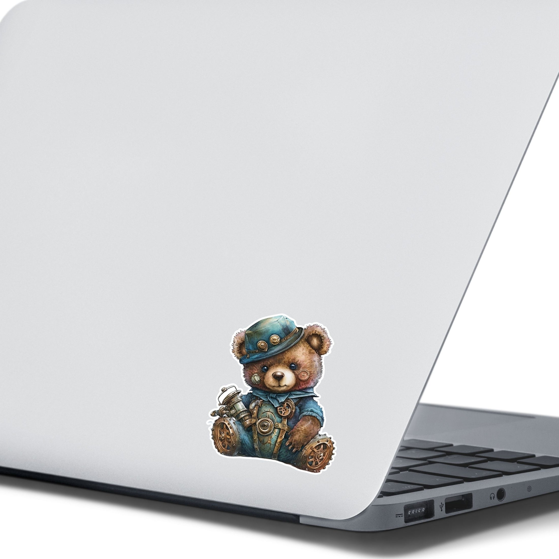 This image shows the steampunk teddy sticker on the back of an open laptop.