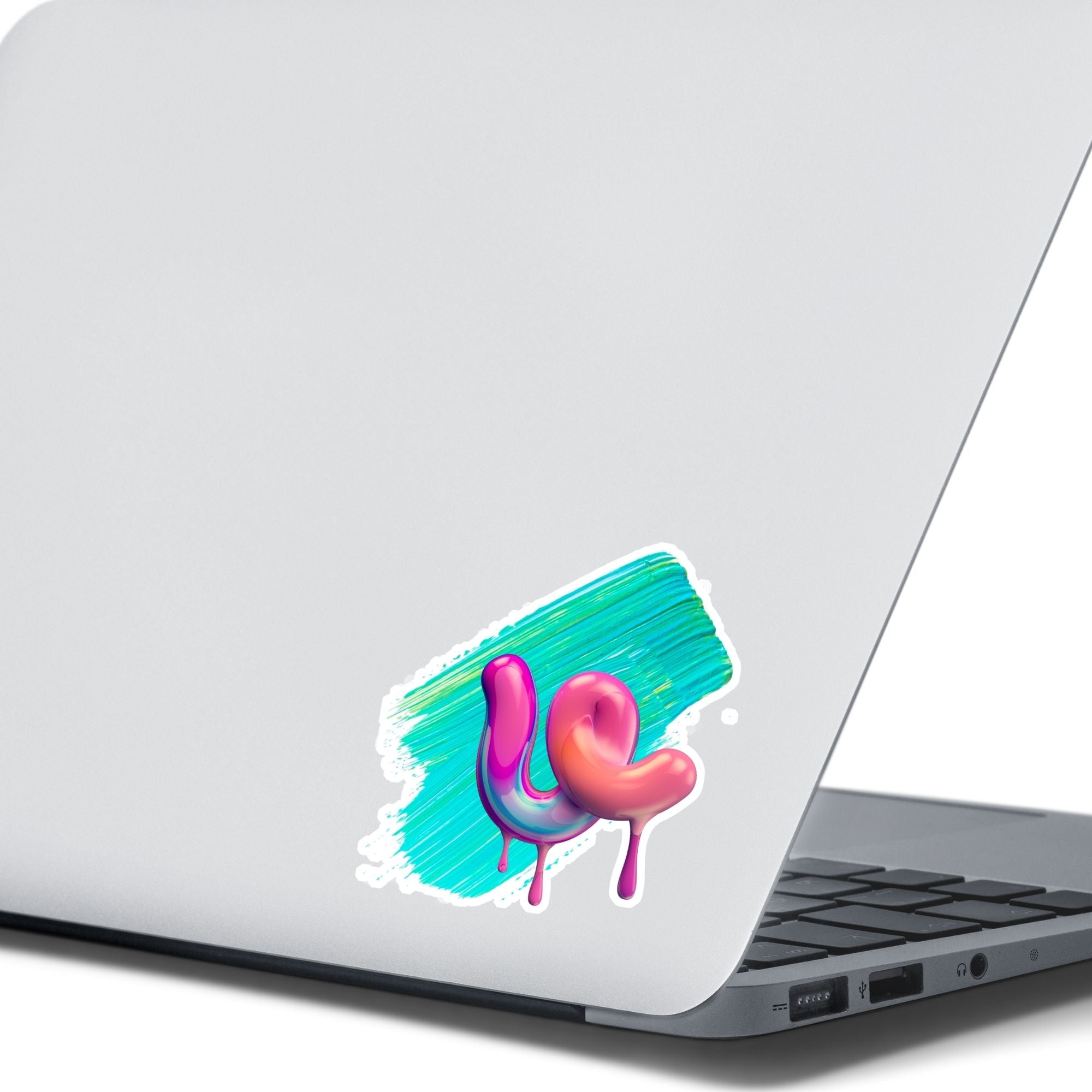 This individual die-cut sticker is one you either like or don't like; it's very unique! Featuring a 3D paint drip in pinks and purples over a green and blue paint swath, this sticker is hard to explain but pretty interesting to see. This image shows the 3D Drip sticker on the back of an open laptop.