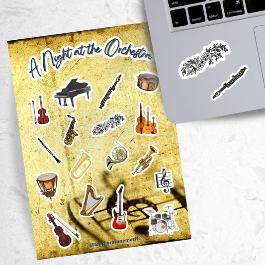 This sticker sheet celebrates all things music! Strings, brass, woodwinds, and percussion stickers that are perfect for any music lover. This image shows the sticker sheet next to an open laptop with a sticker of a music notes surrounded by leaves and vines and a sticker of a flute applied below the keyboard.
