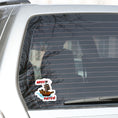 Load image into Gallery viewer, Hoist the main and prepare to board! This individual die-cut sticker is of a pirate ship under sail with the words "Ahoy Matey!" This image shows the pirate sticker on the back window of a car.
