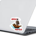 Load image into Gallery viewer, Hoist the main and prepare to board! This individual die-cut sticker is of a pirate ship under sail with the words "Ahoy Matey!" This image shows the pirate ship on the back of an open laptop.
