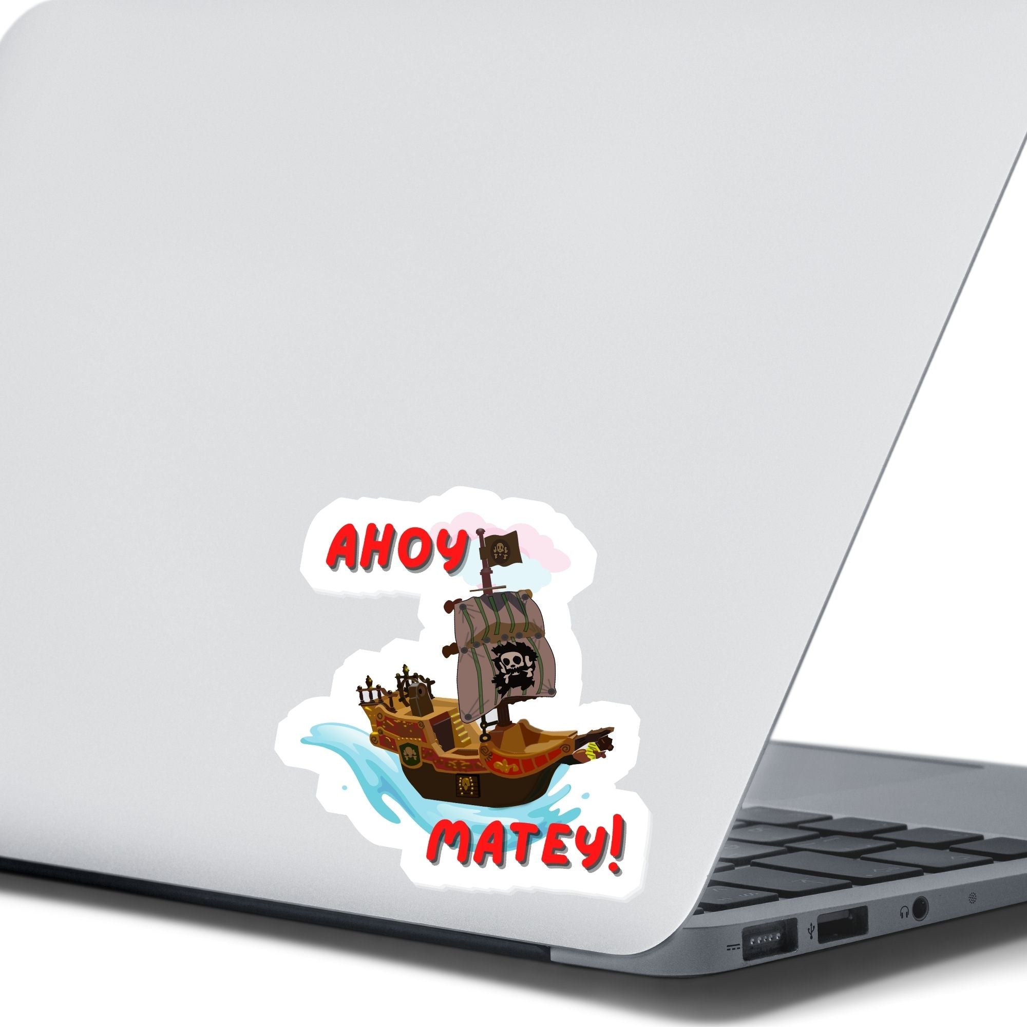 Hoist the main and prepare to board! This individual die-cut sticker is of a pirate ship under sail with the words "Ahoy Matey!" This image shows the pirate ship on the back of an open laptop.