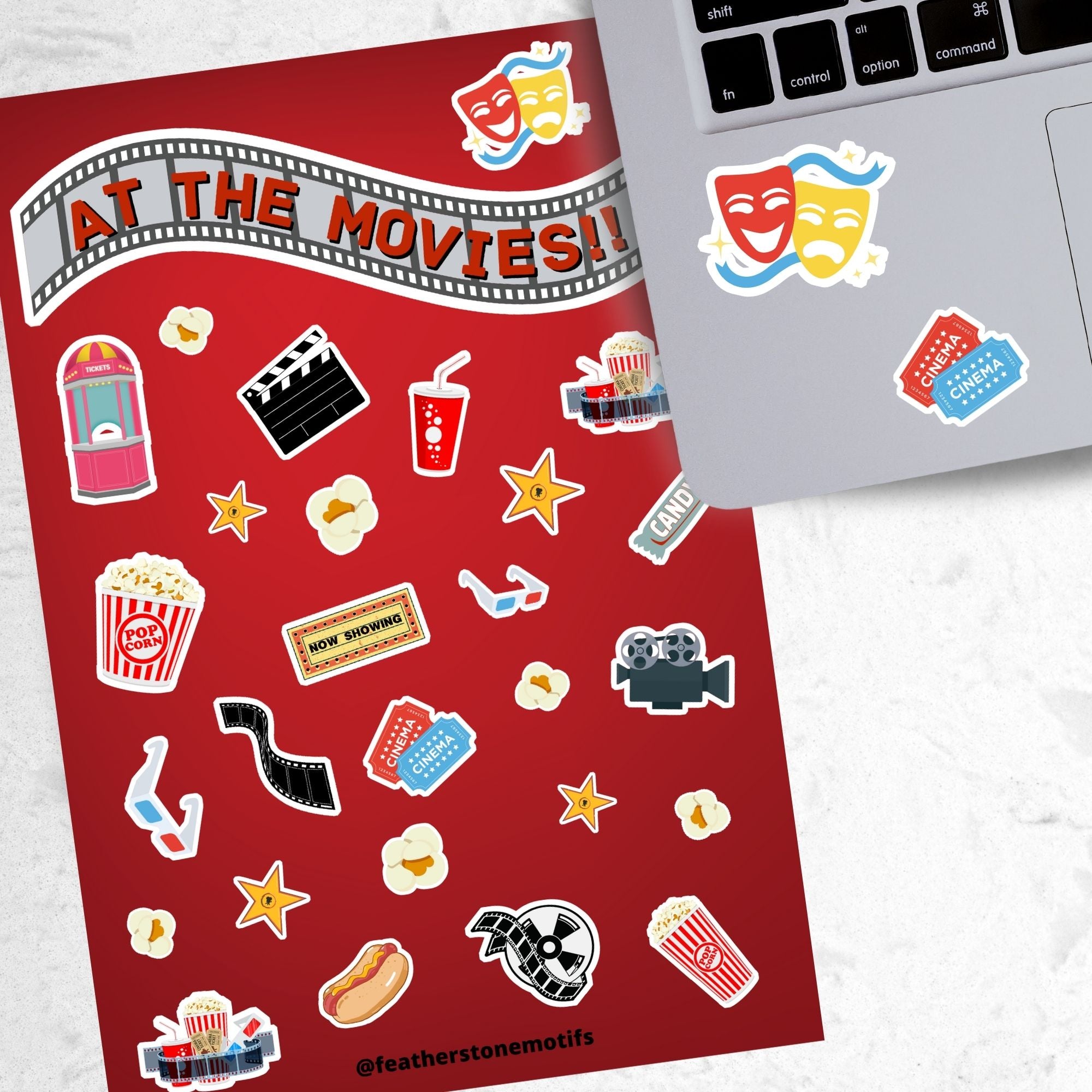 Get your tickets, buy your snacks, and enjoy a night at the movies! This sticker sheet is filled with sticker images like: Popcorn, movie reel, camera, hotdog, soda, and 3D glasses. This image shows the sticker sheet next to an open laptop with stickers of comedy/tragedy masks, and cinema tickets applied below the keyboard. 