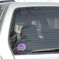 Load image into Gallery viewer, Be You - words to live by! This individual die-cut sticker features "Be You" in multiple pastel colors on a lavender background. This image shows the Be You! die-cut sticker on the back window of a car.
