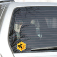 Load image into Gallery viewer, Bee Happy! This individual die-cut sticker is a great motivator. It features a honeycomb background with the silhouette of a bee and the word happy - enough said! This image shows the Bee Happy die-cut sticker on the back window of a car.
