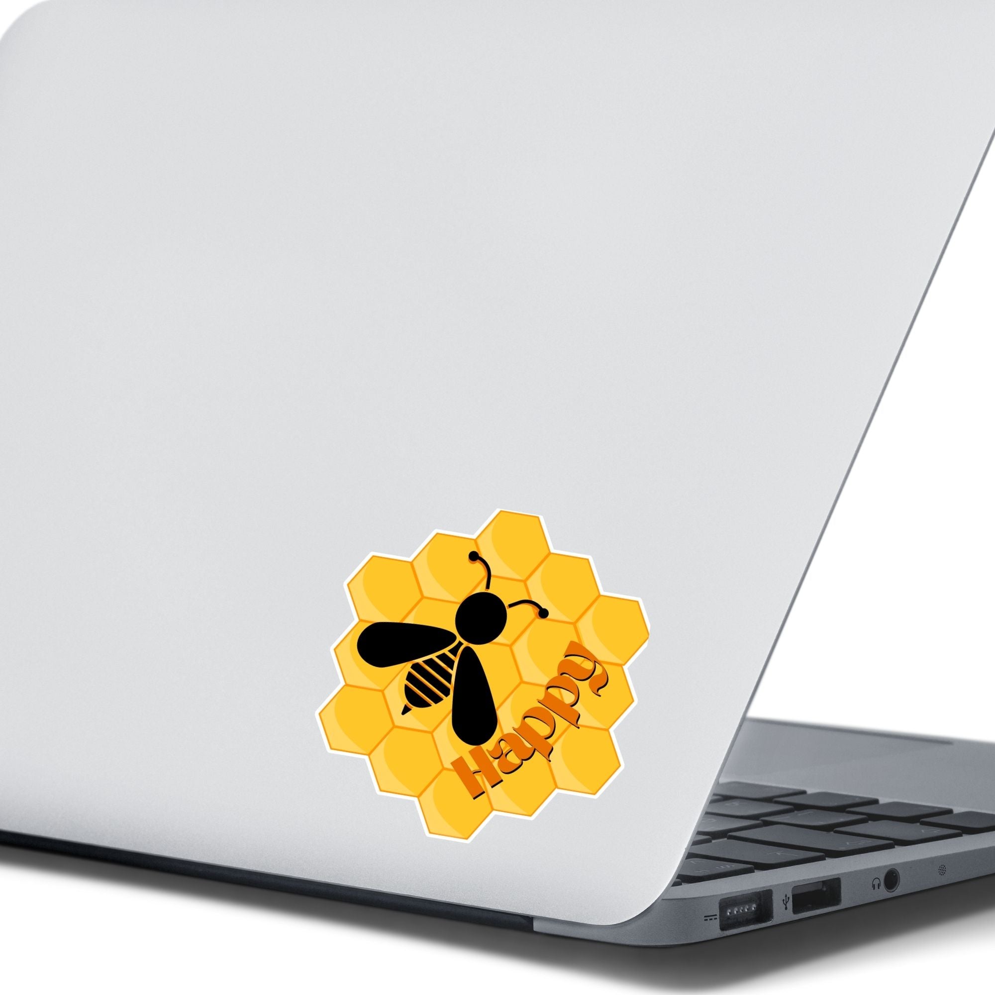 Bee Happy! This individual die-cut sticker is a great motivator. It features a honeycomb background with the silhouette of a bee and the word happy - enough said! This image shows the Bee Happy sticker on the back of an open laptop.