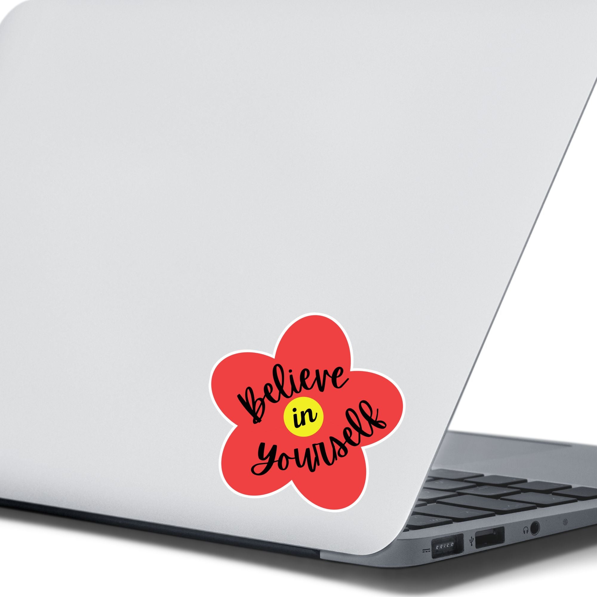 This inspirational individual die-cut sticker features a red flower with a yellow center, with the words Believe in Yourself written across it. Check out our Inspirational collection for more inspiring stickers! This image shows the Believe in Yourself sticker on the back of an open laptop.