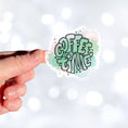 Load image into Gallery viewer, It's Coffee Time! This individual die-cut sticker features the words Coffee Time over a pastel green and pink background. This coffee sticker is great for all coffee lovers! This image shows a hand holding the Coffee Time sticker.
