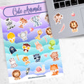 Load image into Gallery viewer, This sticker sheet has a sparkle overlay and it features stickers of cute baby animals from a bear to a zebra, with birds, lions, a monkey, and even snakes and snails in between. This image shows the sticker sheet next to an open laptop with stickers of a monkey, lion, feather, and apple applied below the keyboard.
