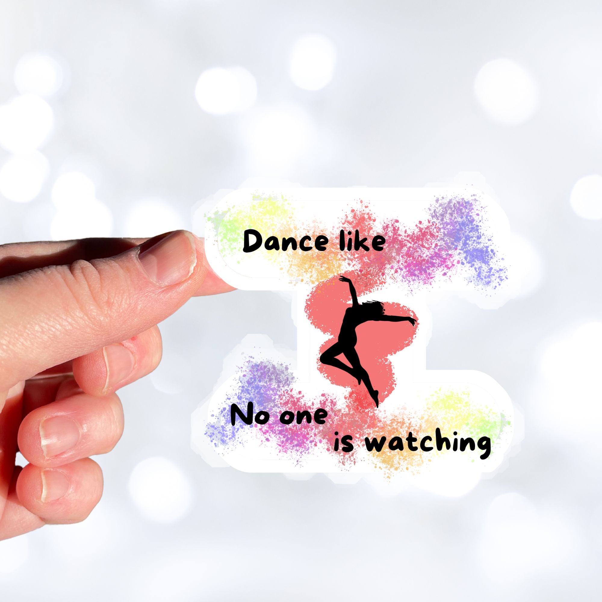 This individual die-cut sticker is perfect for anyone who loves to dance! It features the silhouette of a dancer in the center with the words "Dance like No one is watching", all on a spray paint pastel background. Check out our Inspirational collection for more inspiring stickers! This image shows a hand holding the Dance like No one is watching sticker.