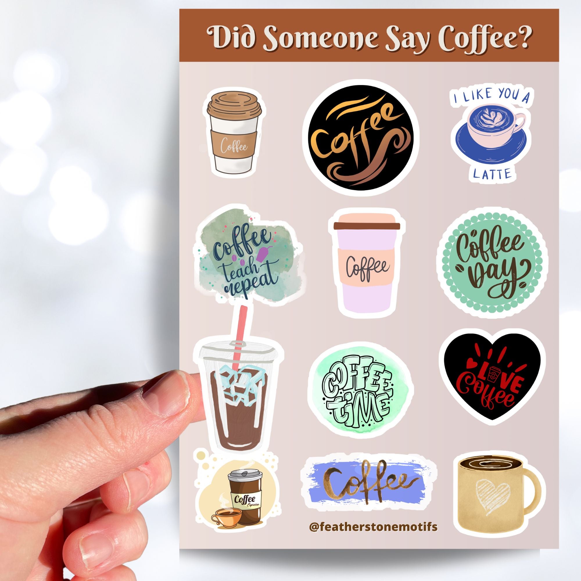 This sticker sheet has a dozen unique coffee related stickers to show how you feel about your favorite beverage. This image shows a hand holding an iced coffee above the sticker sheet.