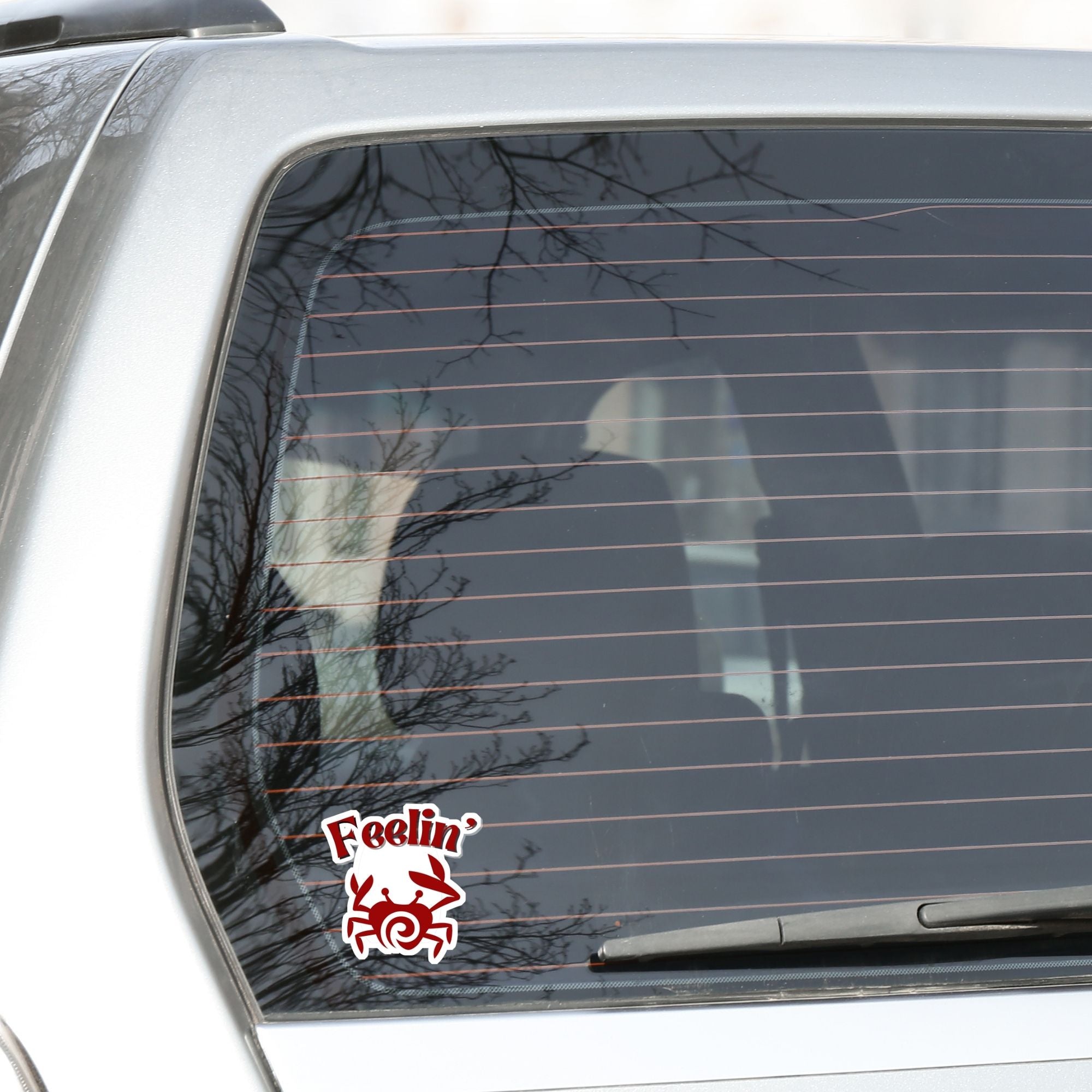 Feelin Crabby? Naw, but sometimes this die cut sticker of a crab is just right for nearly everyone! This image shows the Feelin Crabby sticker on the back window of a car.