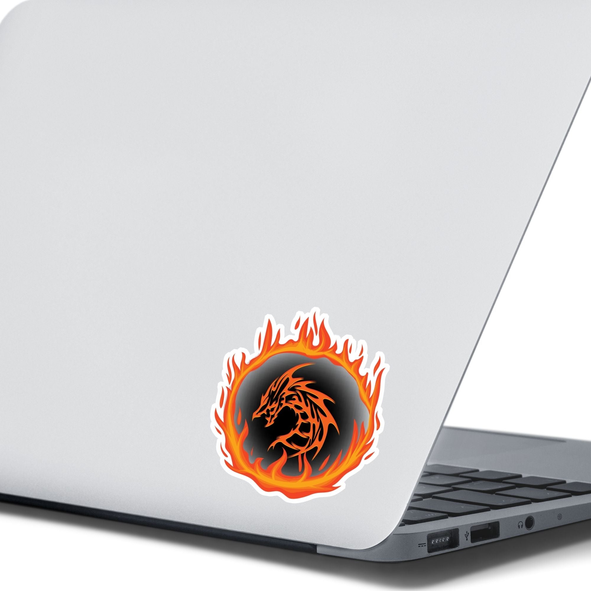 Who dares to disturb the Fire Dragon? This individual die-cut sticker features a fiery orange dragon surrounded by a ring of fire.  This image shows the Fire Dragon sticker on the back of an open laptop.