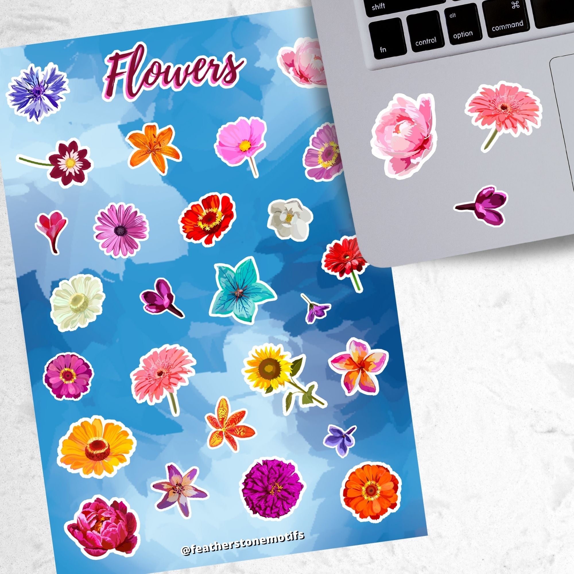 So many flowers! This sticker sheet is filled with images of all your favorite flowers. This image shows the sticker sheet next to an open laptop with three different flower stickers applied below the keyboard.