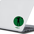 Load image into Gallery viewer, Show your love of golf with this individual die-cut sticker! This sticker shows the silhouette of a golfer with a ponytail about to swing, on a green golf ball background, with the word "Fore!" below.  This image shows the golf sticker on the back of an open laptop.
