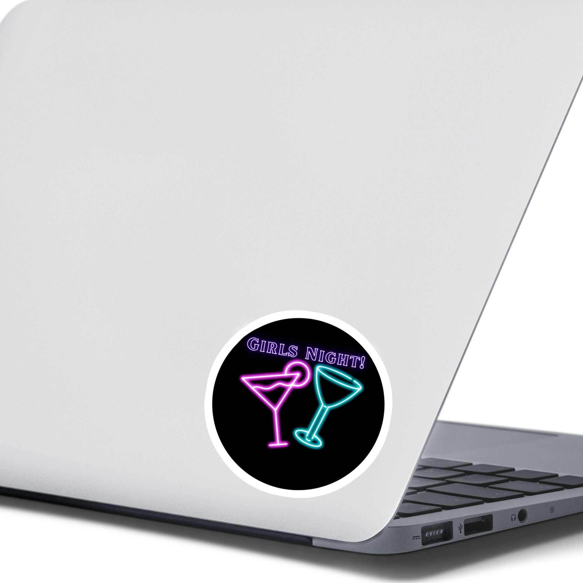 Ladies, it's time to hit the town! This neon die-cut sticker features a couple of cocktail glasses with "Girls Night!" written above. Enjoy! This image shows the Girls Night sticker on the back of an open laptop.
