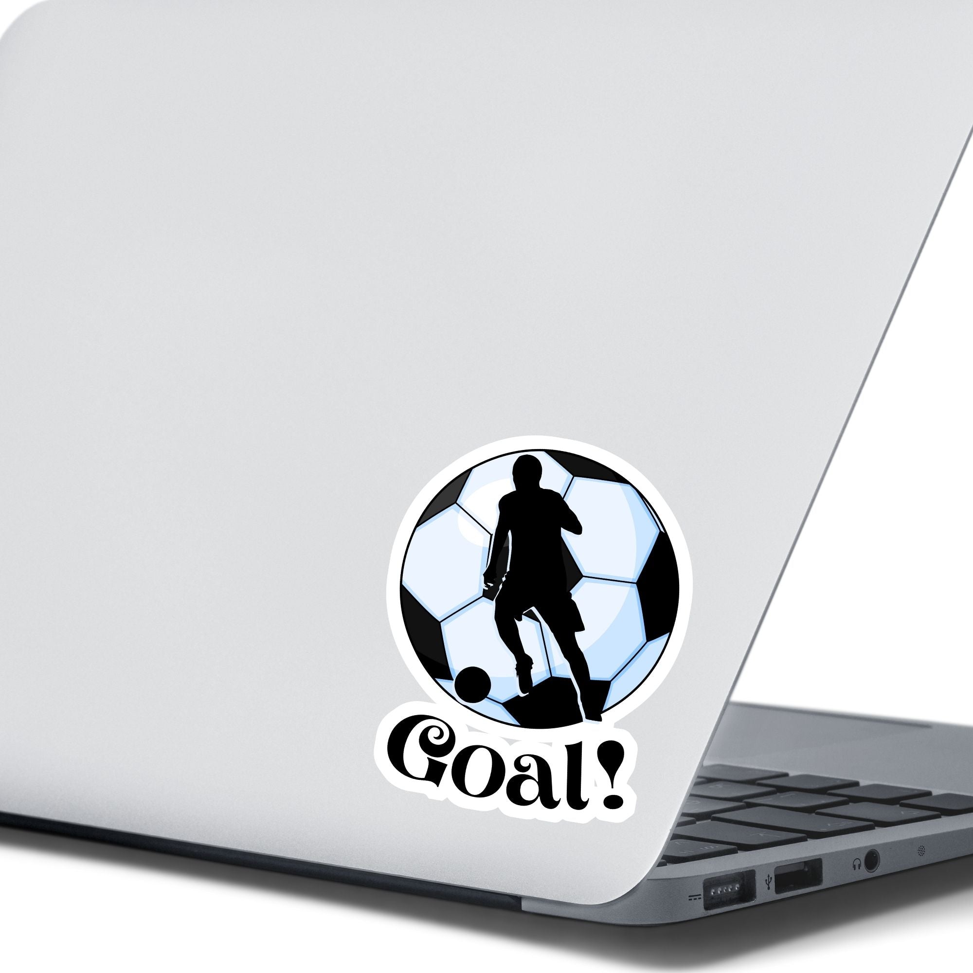 Show your love of soccer, or football, with this individual die-cut sticker! This sticker shows the silhouette of a player about to kick, on a black and white/blue soccer ball background, with the word "Goal!" below. This image shows the soccer sticker on the back of an open laptop.