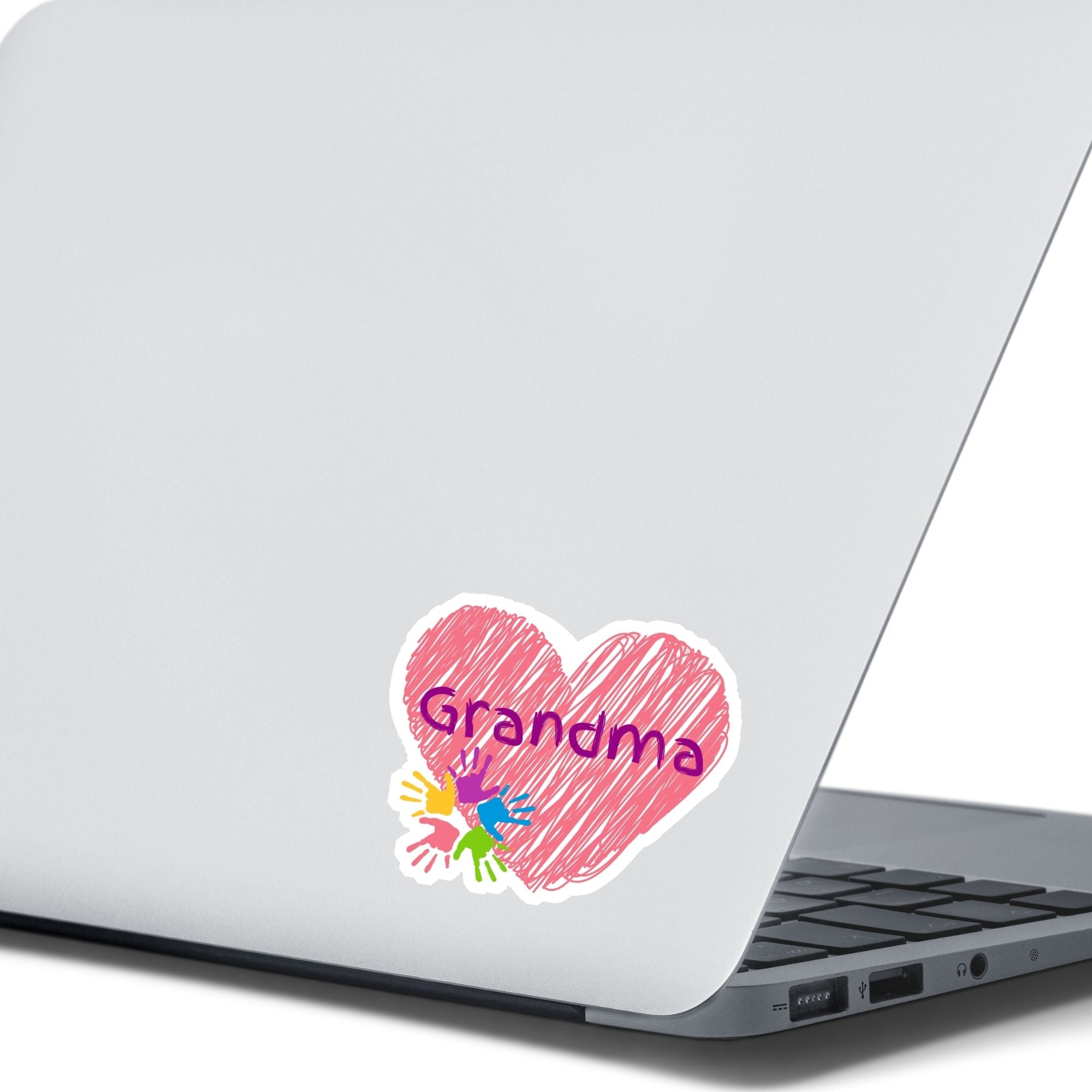 Show how much you love grandma with this individual die-cut sticker. This makes a great gift for grandma, or for all grandma's to proudly show they are a grandmother! This sticker features a red scribbled heart with Grandma written across the middle and 5 small paint hands on the lower left side. This image shows the Grandma sticker on the back of an open laptop.