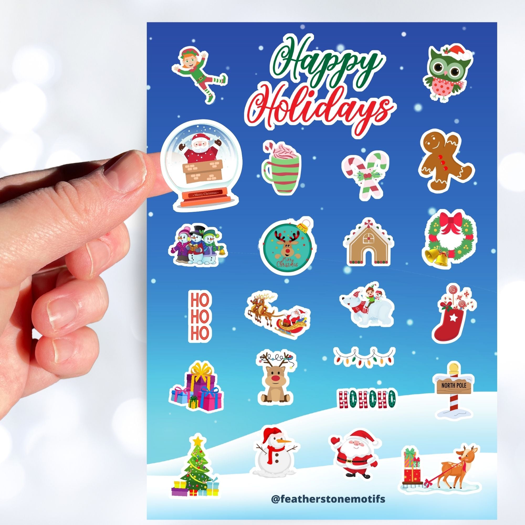 Celebrate the holidays with this winter themed sticker sheet. With sticker images of Santa, elves, snowmen, and your favorite holiday treats, this sticker sheet will bring holiday cheer to every household! It also features a holo star overlay for that extra sparkle! This image shows a hand holding a sticker of Santa snow globe over the sticker sheet. 