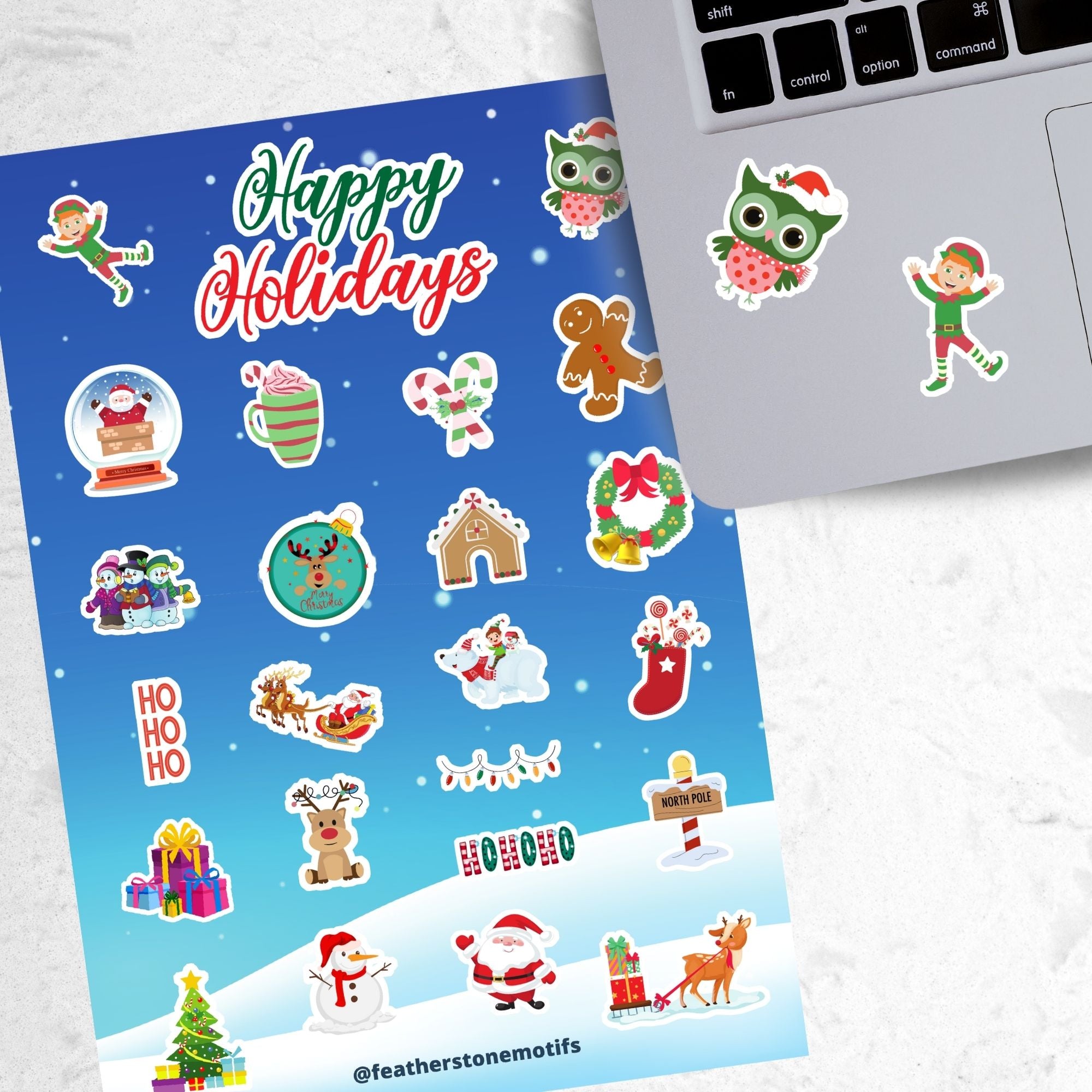 Celebrate the holidays with this winter themed sticker sheet. With sticker images of Santa, elves, snowmen, and your favorite holiday treats, this sticker sheet will bring holiday cheer to every household! It also features a holo star overlay for that extra sparkle! This image shows the sticker sheet next to an open laptop with stickers of a holiday owl and an elf applied below the keyboard.