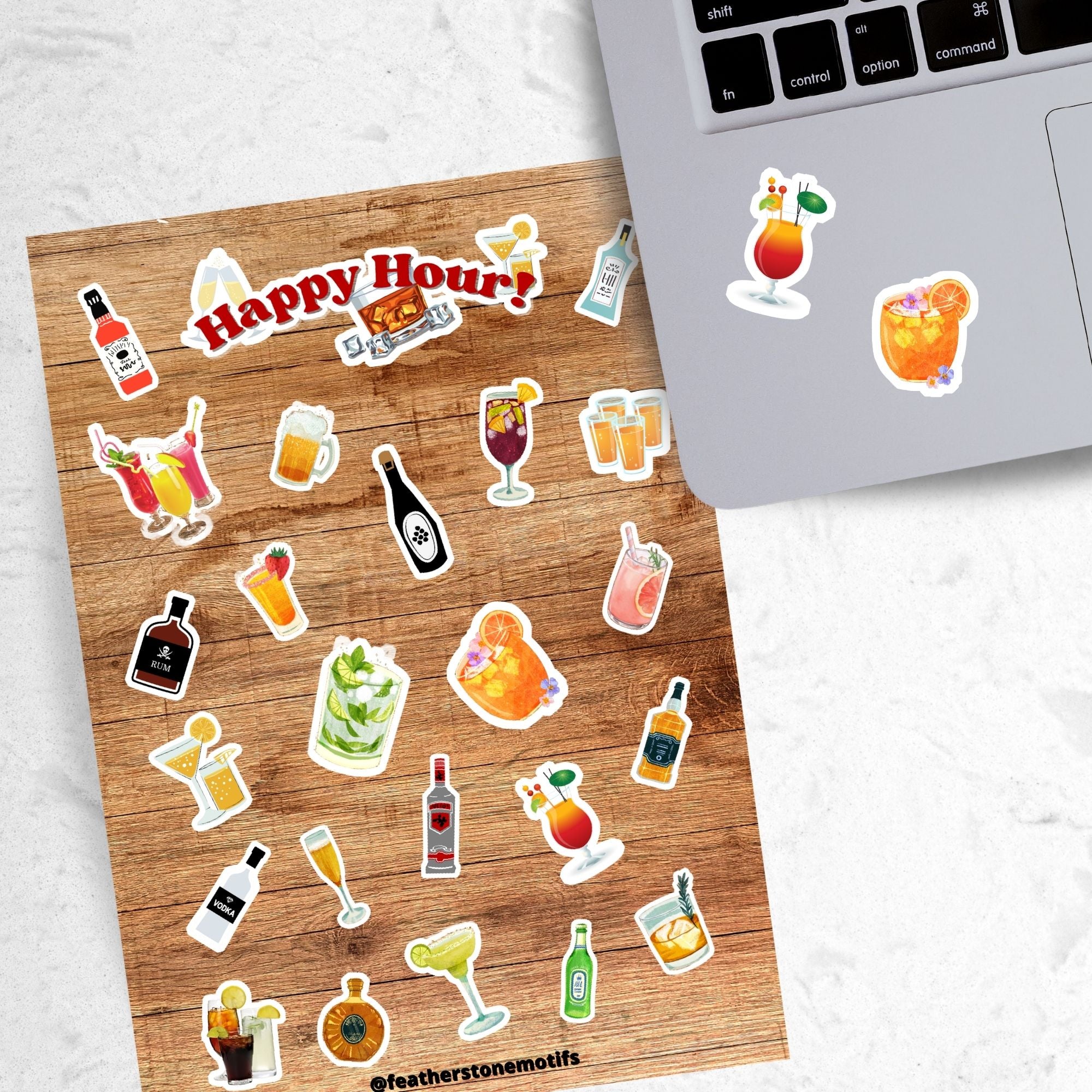 Cheers! Filled with sticker images of your favorite cocktails and adult beverages, this is for adults who can enjoy this sticker sheet responsibly! This image shows the sticker sheet next to an open laptop with stickers of mixed drinks applied below the keyboard.